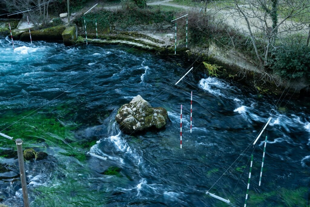 Aerial view of a kayak course on a swirling river in Provence, France.